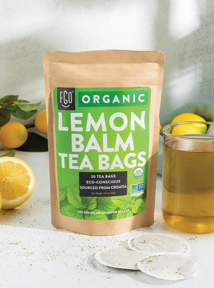 A glass of hot lemon balm tea.