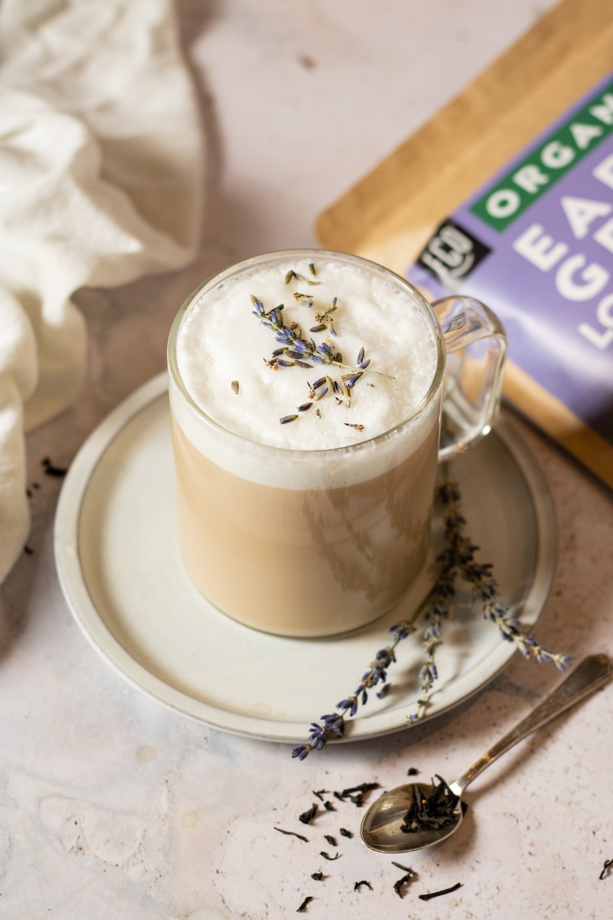 Hot latte with earl grey tea and steamed milk with lavender flowers on top