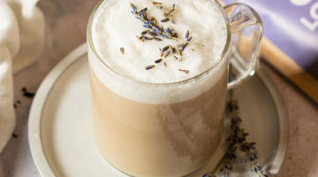 Hot latte with earl grey tea and steamed milk with lavender flowers on top