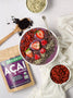 Acai bowl made with freeze-dried acai topped with goji berries, hemp seeds, chia seeds, and fresh berries.