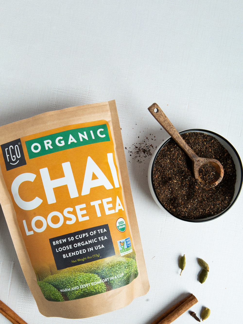 Loose leaf chai tea in a wooden spoon.