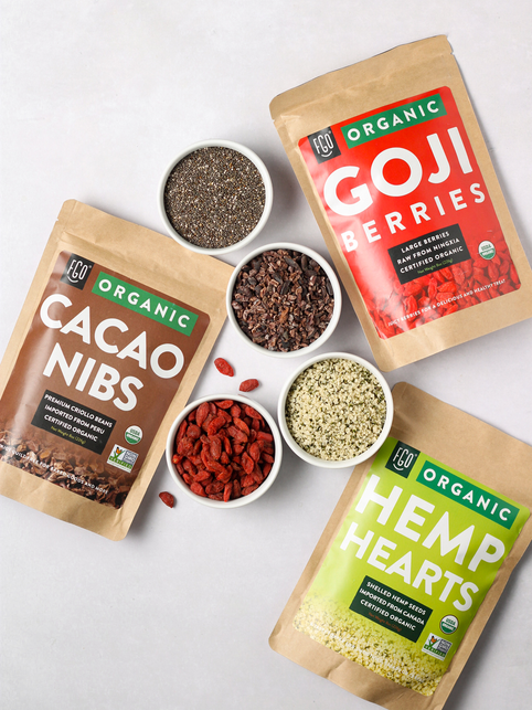 Raw ingredients for acai bowl: goji berries, cacao nibs, and hemp hearts.
