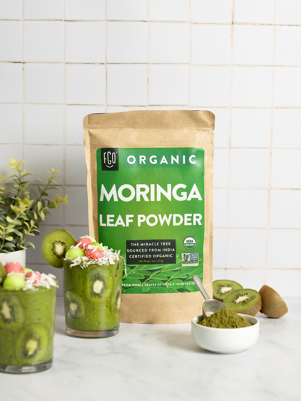A blended smoothie made with moringa leaf powder, spinach, frozen bananas, and fresh kiwi.