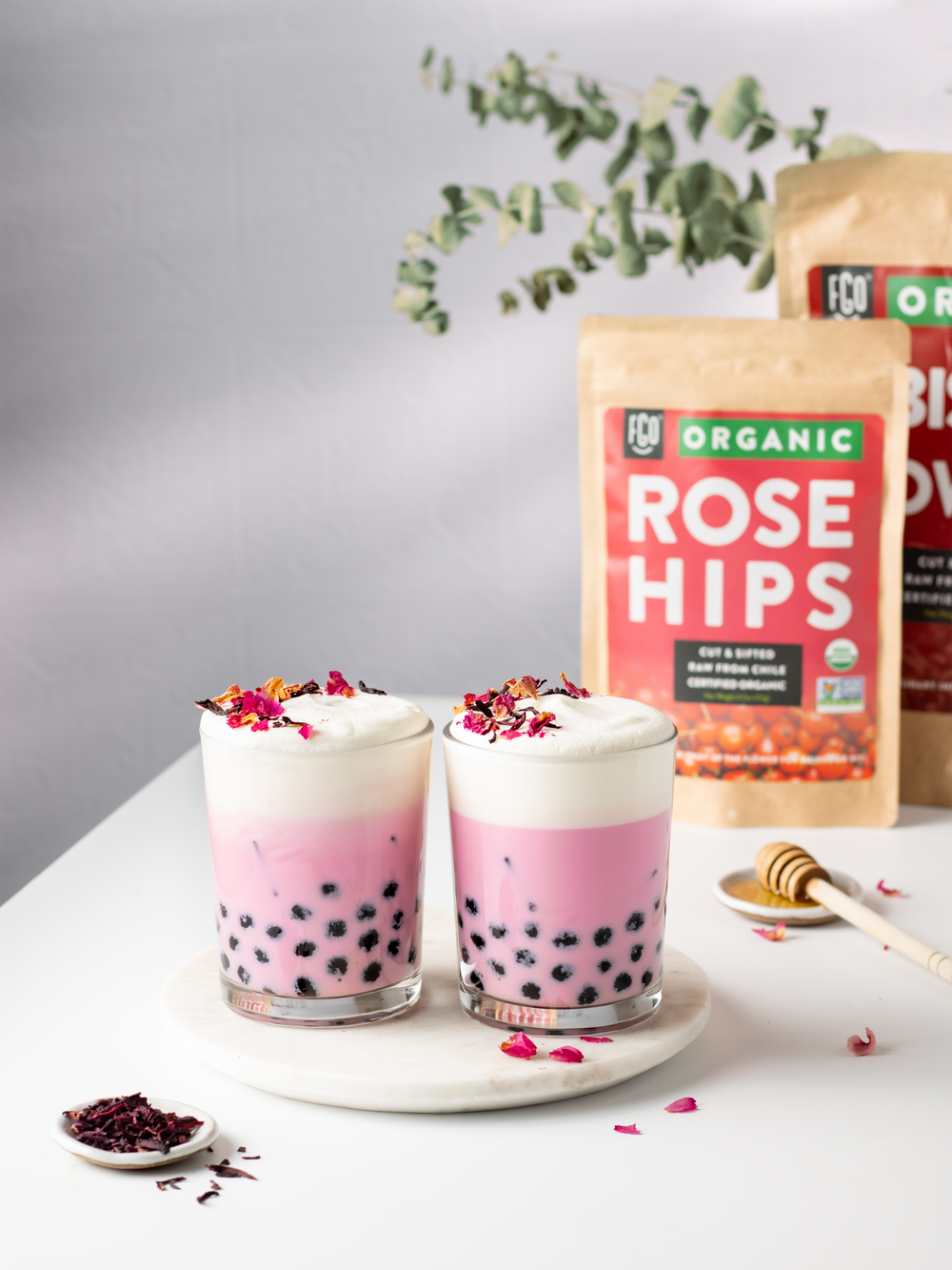 Hibiscus boba milk tea made with cut and sifted rose hips.