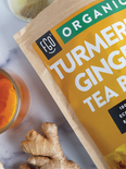Eco-conscious turmeric ginger tea bags.